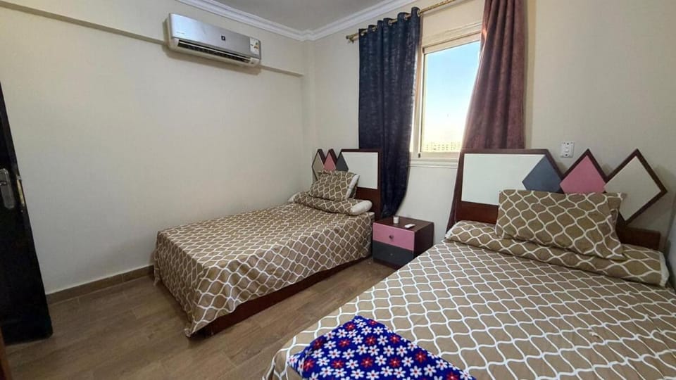 Room 2 in a three-room apartment in the Fifth Settlement compound, with air conditioning Hostel in New Cairo City