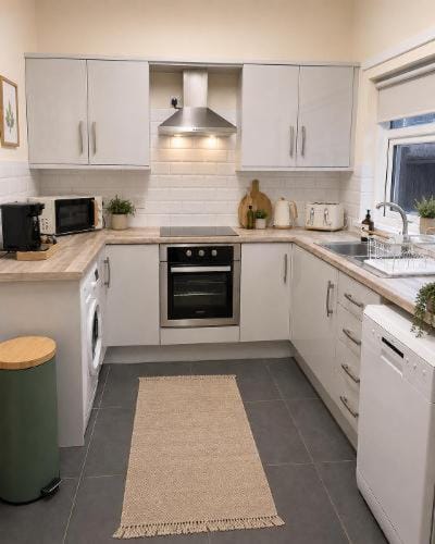 Kitchen or kitchenette, dishwasher, oven, stove, toaster