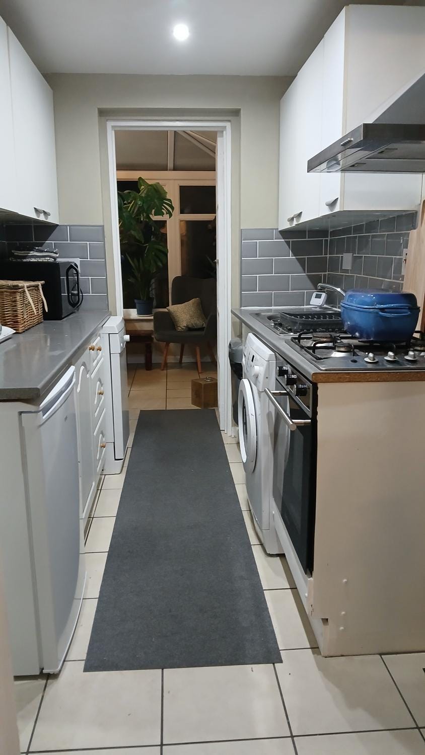 Kitchen or kitchenette, dishwasher, oven, stove, washing machine