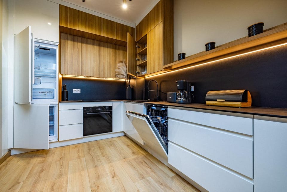 Kitchen or kitchenette, dishwasher, oven, stove