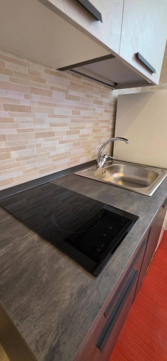 Kitchen or kitchenette, stove