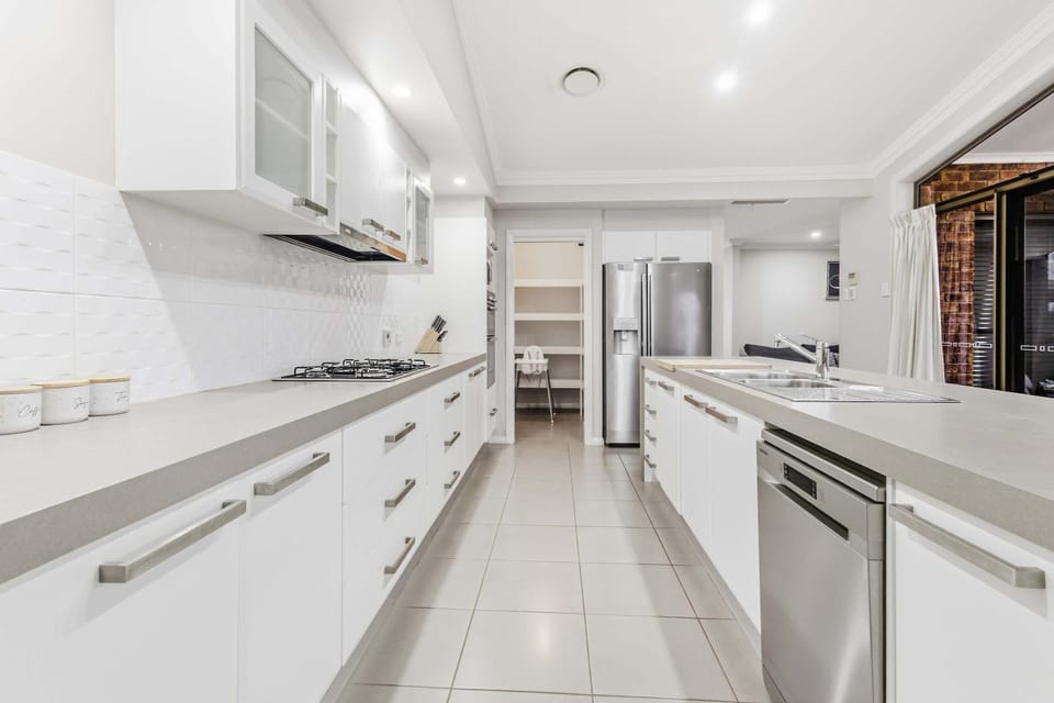 Kitchen or kitchenette, dishwasher, oven, stove