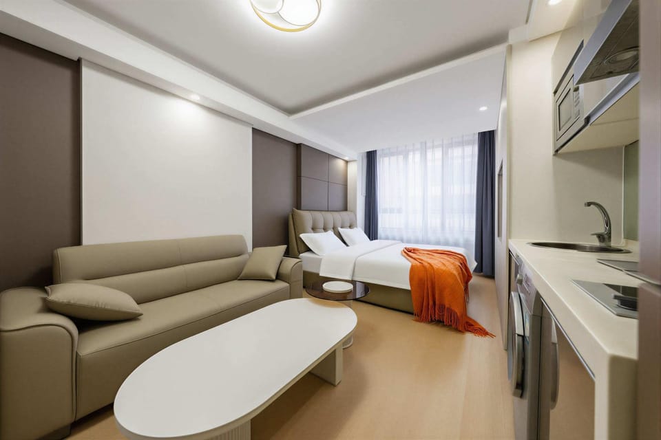 Bed, TV and multimedia, View (from property/room), Kitchen or kitchenette, Living room, Photo of the whole room, Seating area, Bedroom