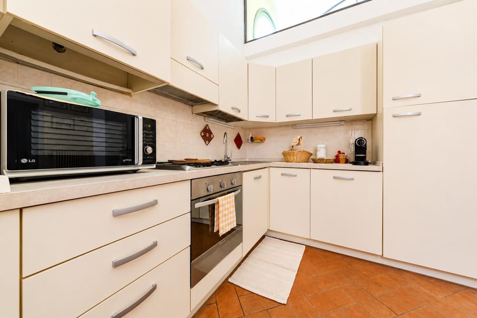 Kitchen or kitchenette, oven, stove, toaster