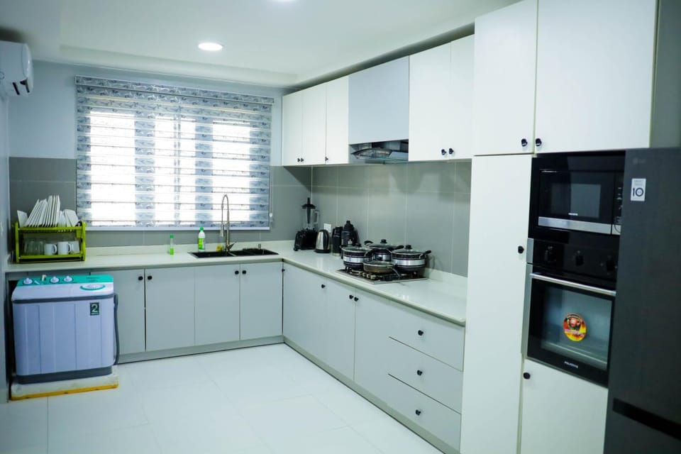 Kitchen or kitchenette, dishwasher, oven, stove