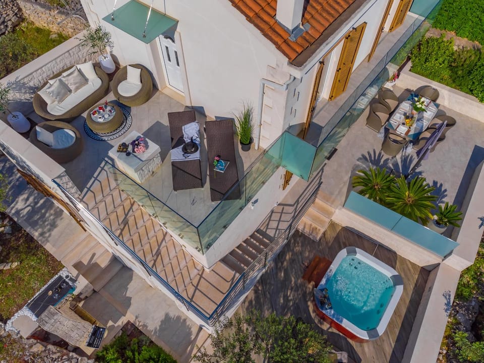Uniquely designed Villa Ivana with outdoor Jacuzzi nearby the pebble Banje beach at the Island of Solta Villa in Split-Dalmatia County