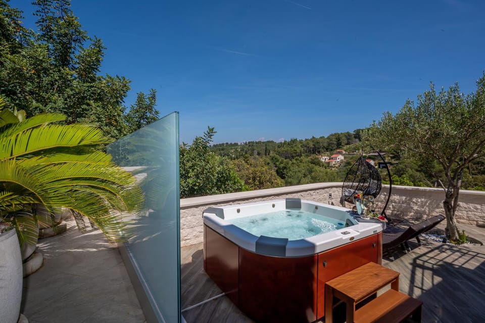 Uniquely designed Villa Ivana with outdoor Jacuzzi nearby the pebble Banje beach at the Island of Solta Villa in Split-Dalmatia County