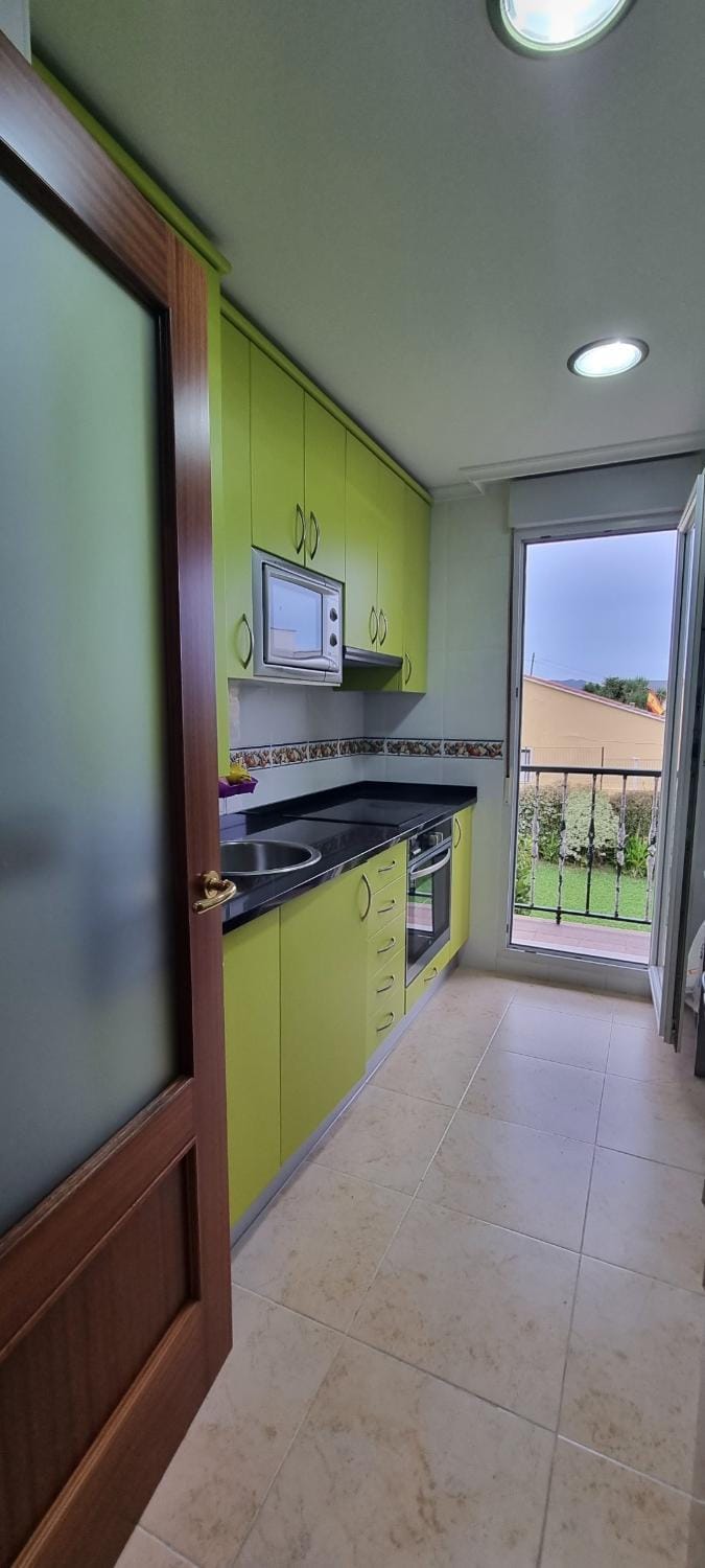 Kitchen or kitchenette, dishwasher, oven, stove