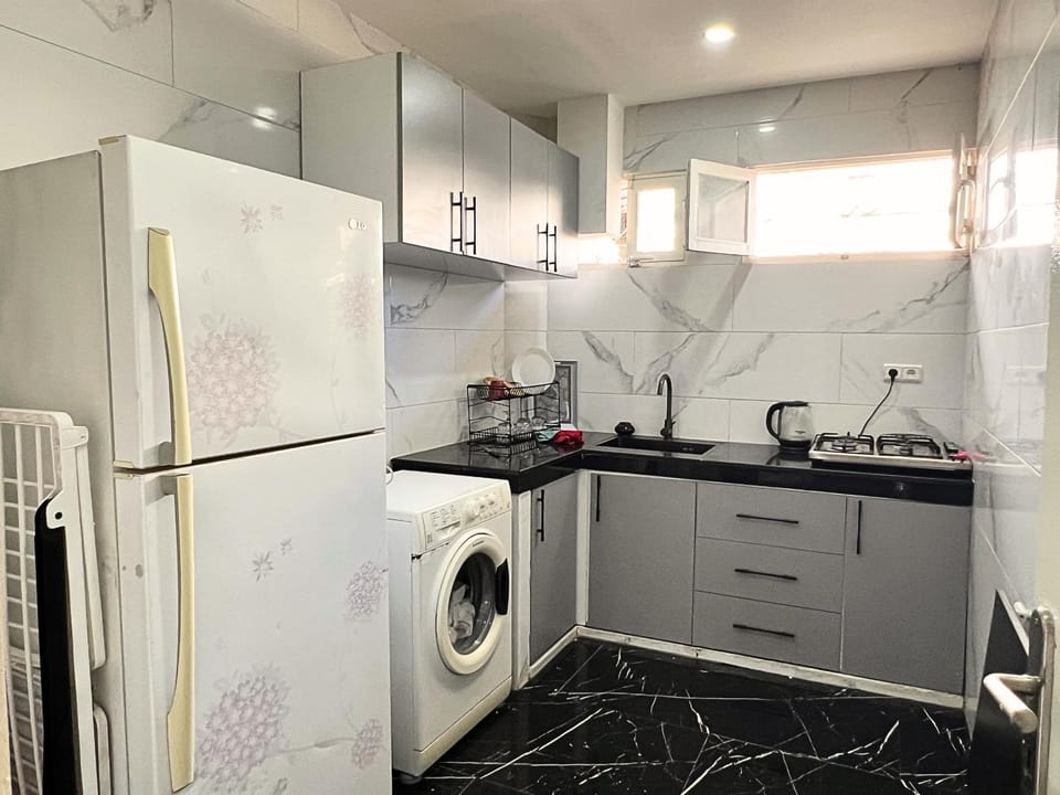 Kitchen or kitchenette, stove, washing machine