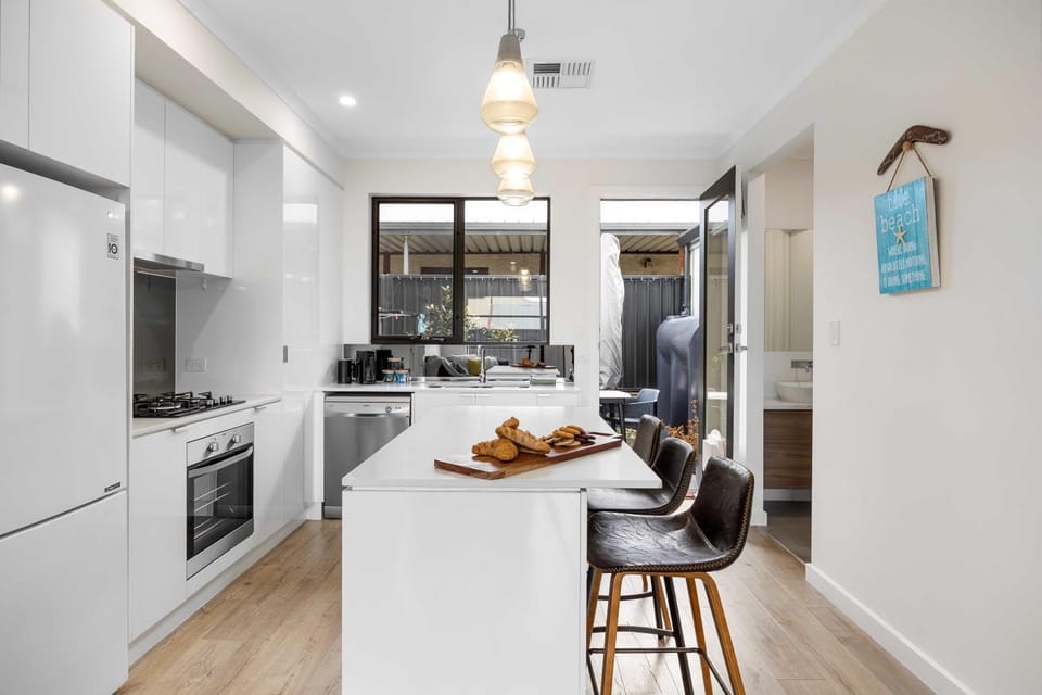 Kitchen or kitchenette, dishwasher, oven, stove