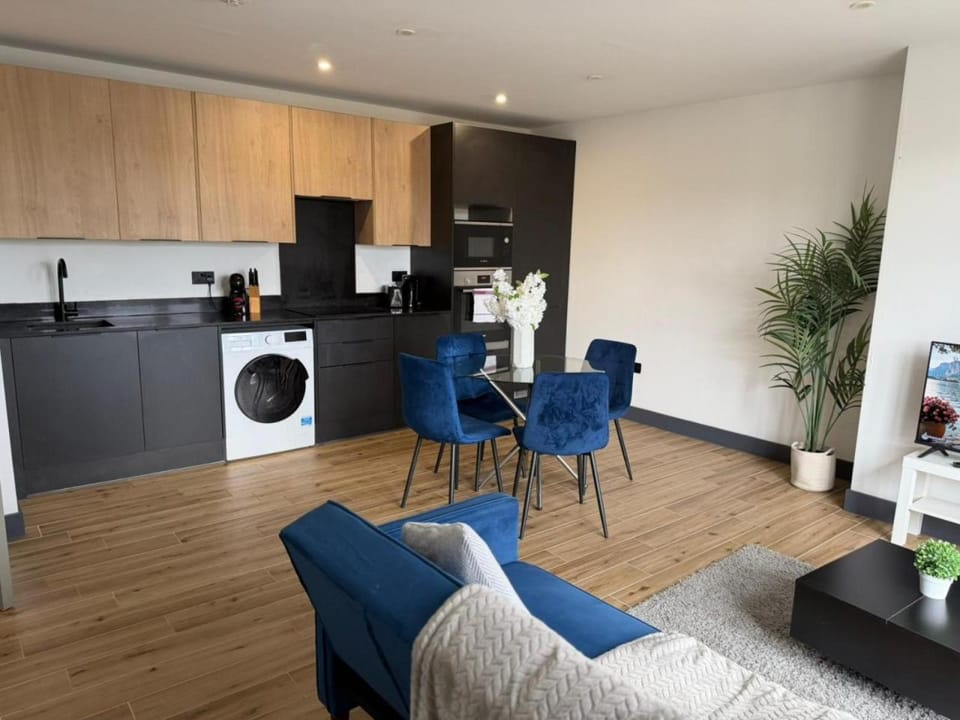 Kitchen or kitchenette, Living room, Seating area, Dining area, dishwasher, oven, stove, toaster, washing machine, dryer