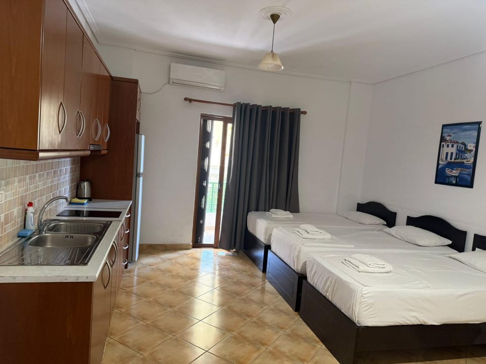 Bed, Kitchen or kitchenette, towels, air conditioner