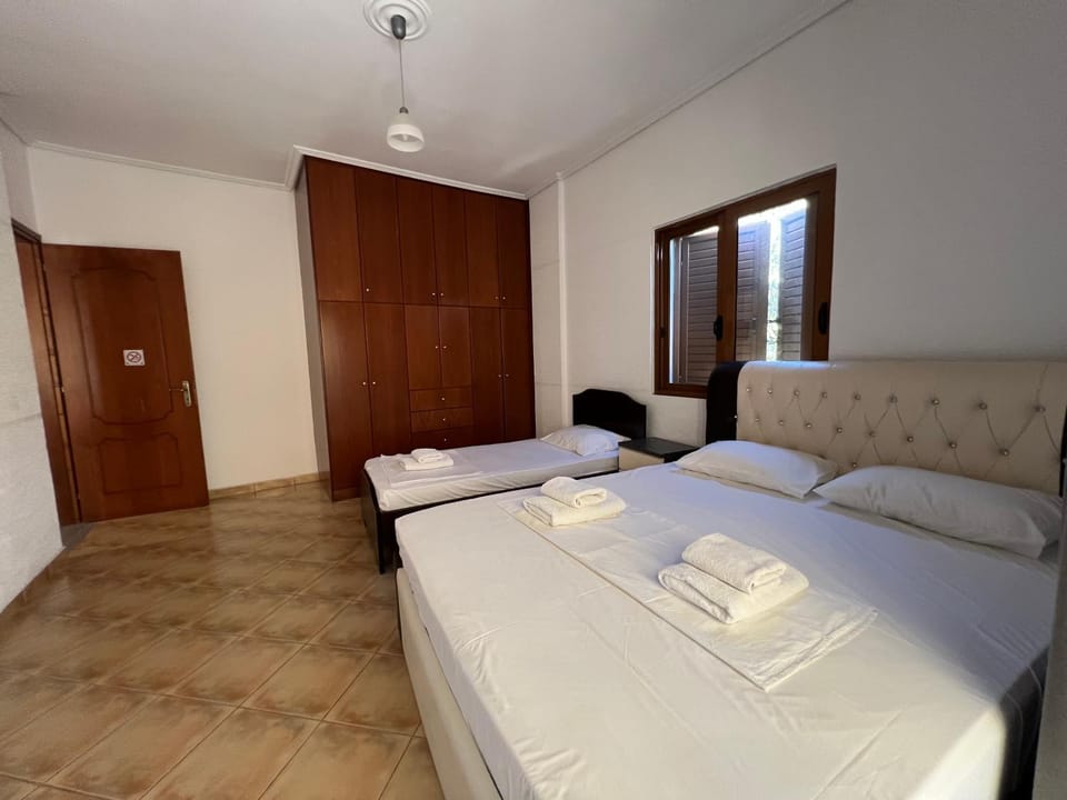 Bed, towels, wardrobe