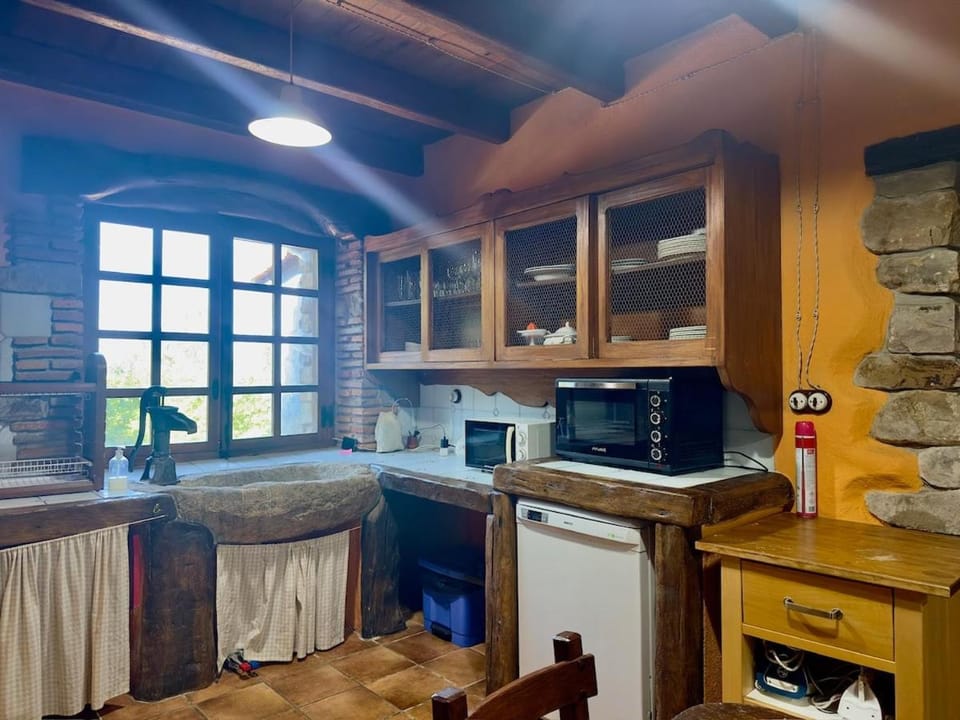 Kitchen or kitchenette, dishwasher, microwave, oven