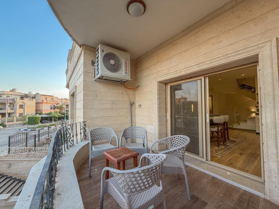 Property building, Patio, Day, View (from property/room), Balcony/Terrace, Living room, Seating area, Dining area, air conditioner