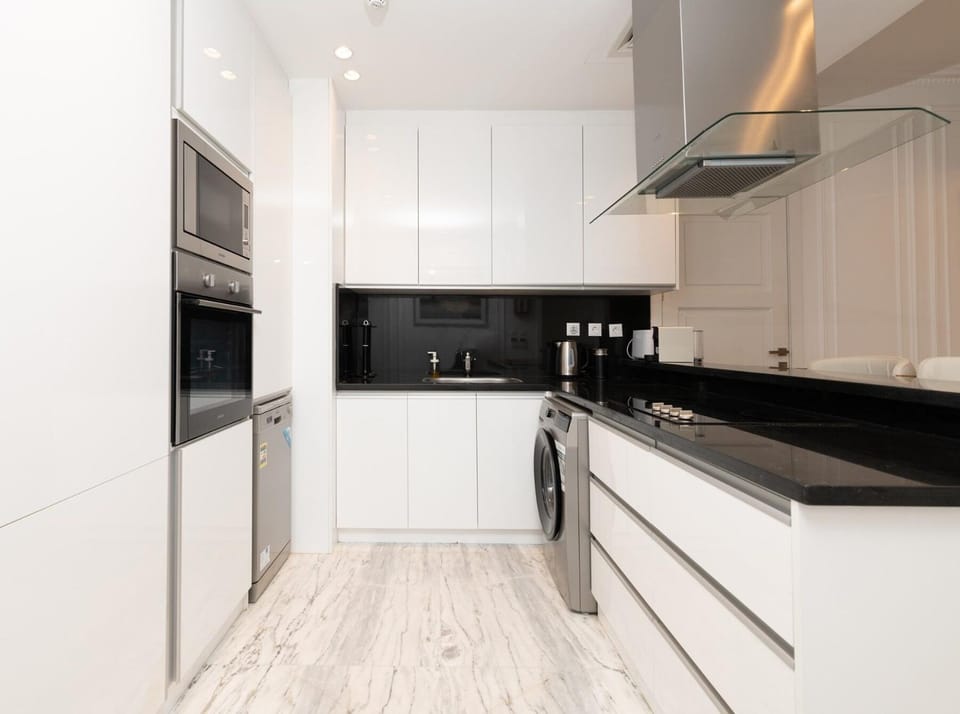 Kitchen or kitchenette, dishwasher, oven, stove