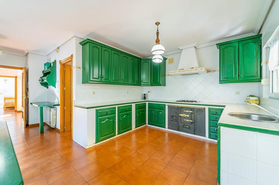 Kitchen or kitchenette, dishwasher, oven, stove