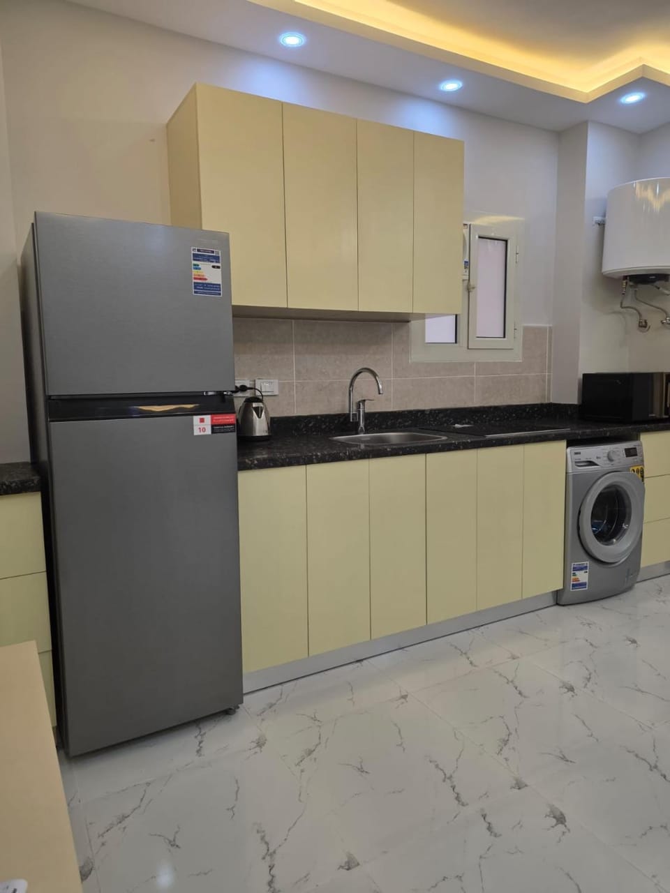 Kitchen or kitchenette, washing machine