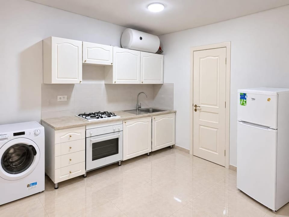 Kitchen or kitchenette, dishwasher, oven, stove, washing machine, dryer