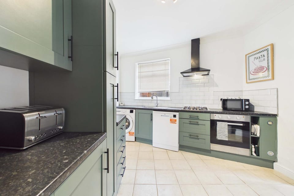 Kitchen or kitchenette, dishwasher, oven, stove, toaster