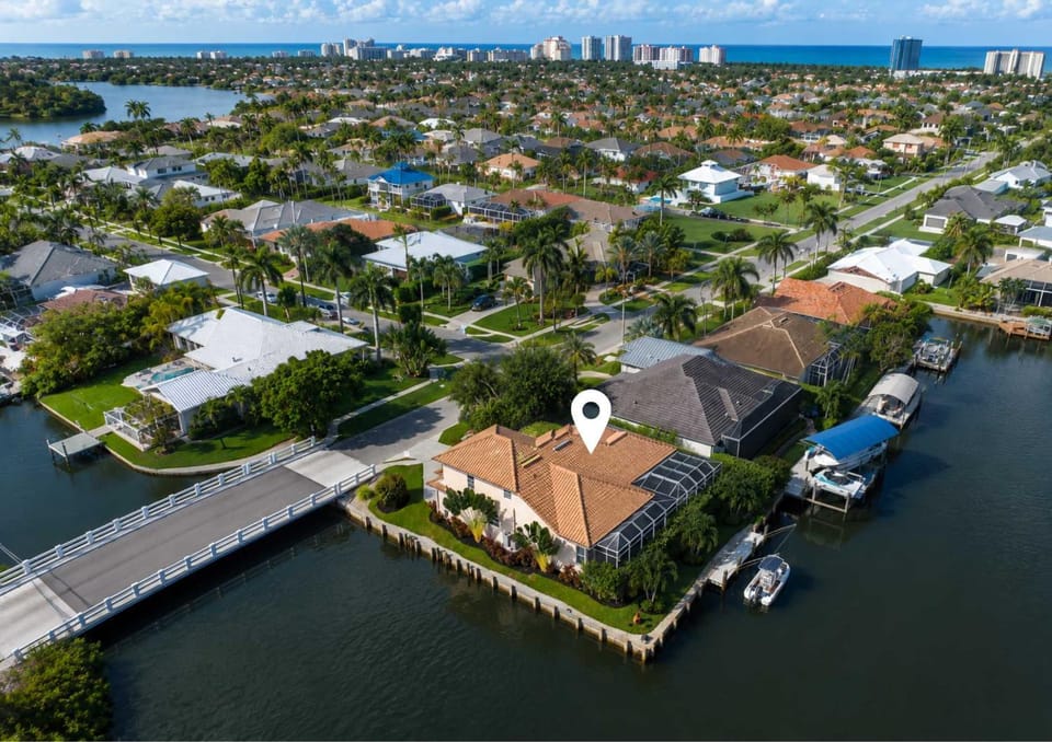 Waterfront Oasis Pool Private Dock Firepit House in Marco Island