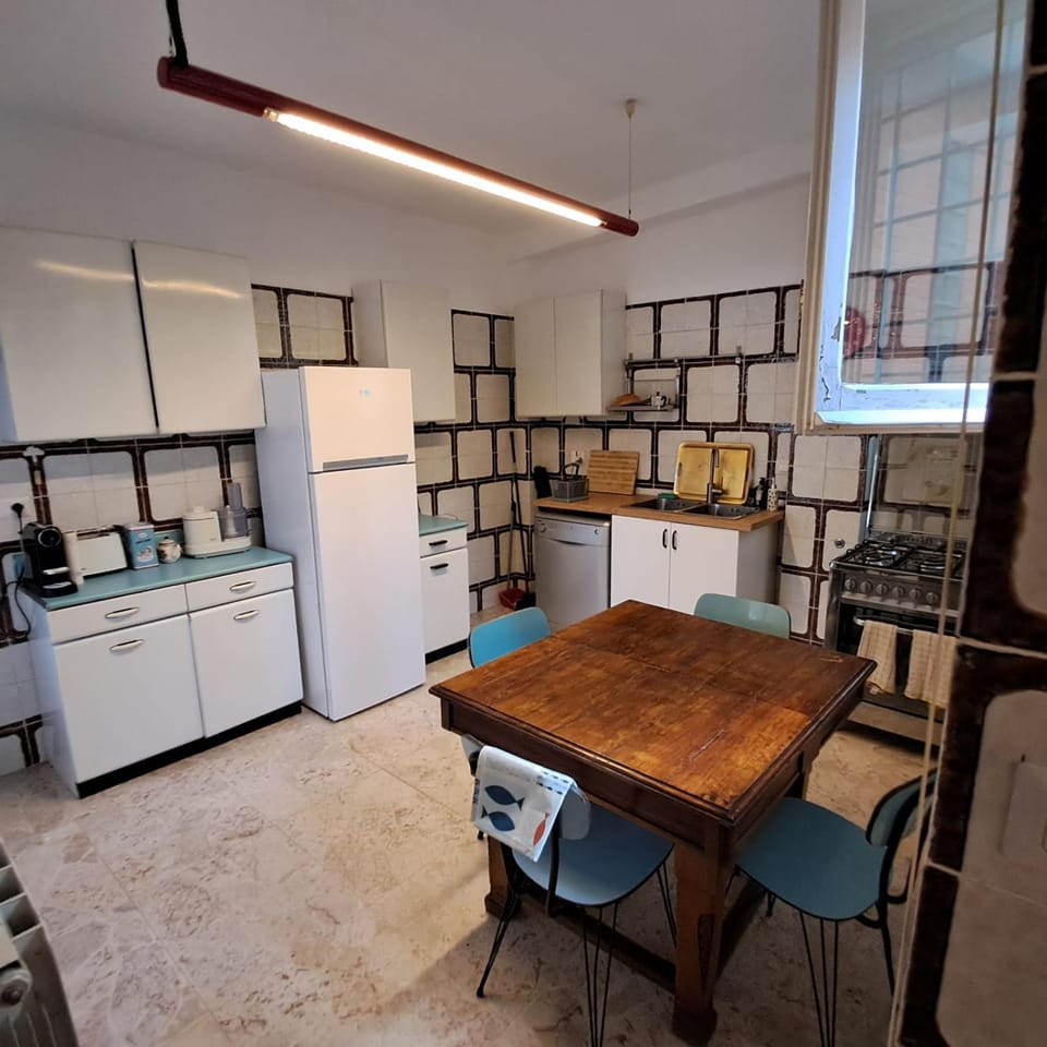 Kitchen or kitchenette, dishwasher, oven, stove