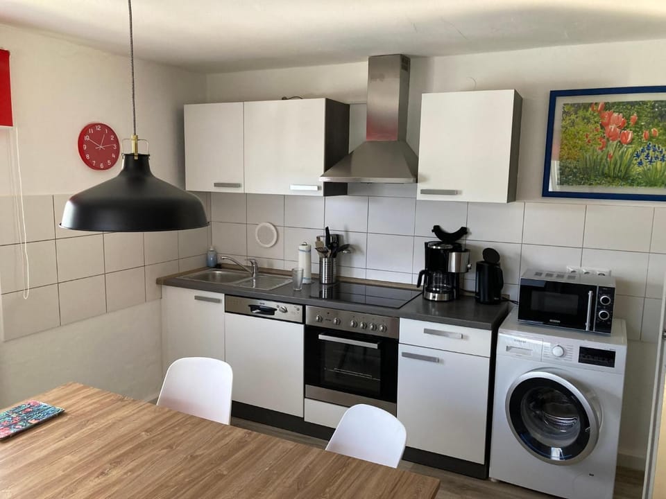 Kitchen or kitchenette, dishwasher, oven, stove, washing machine