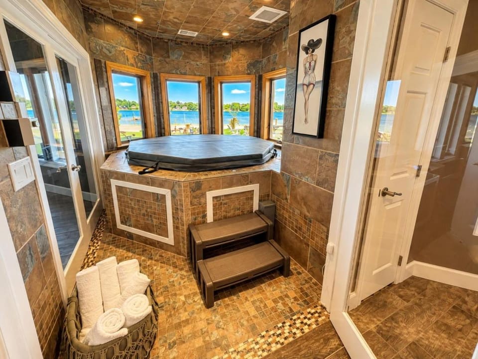 Private Island Retreat With Beach and Hot Tub House in Battle Creek