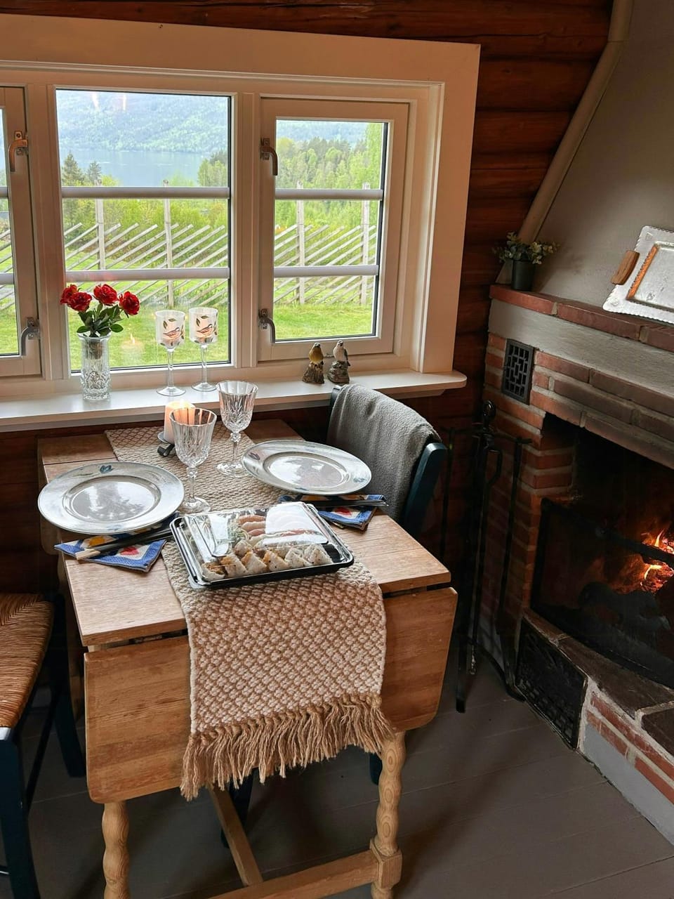 Cabin cluster with bonfire near Lake Eikeren Cabin in Viken, Norway