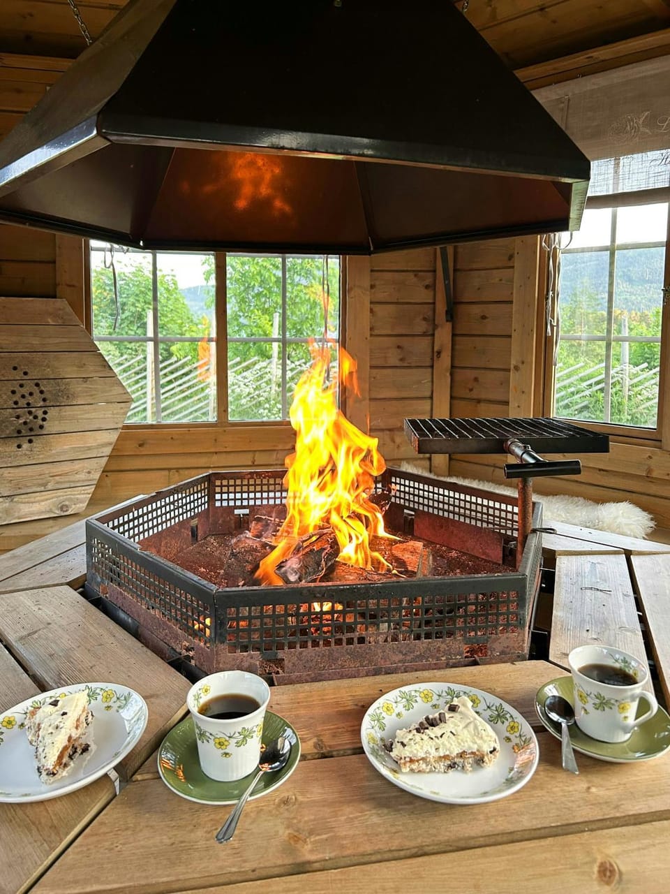 Cabin cluster with bonfire near Lake Eikeren Cabin in Viken, Norway