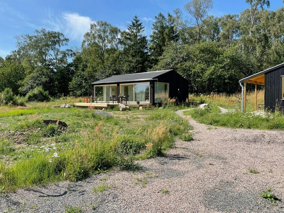 Modern black timber house on the Bjare Peninsula House in Skåne County