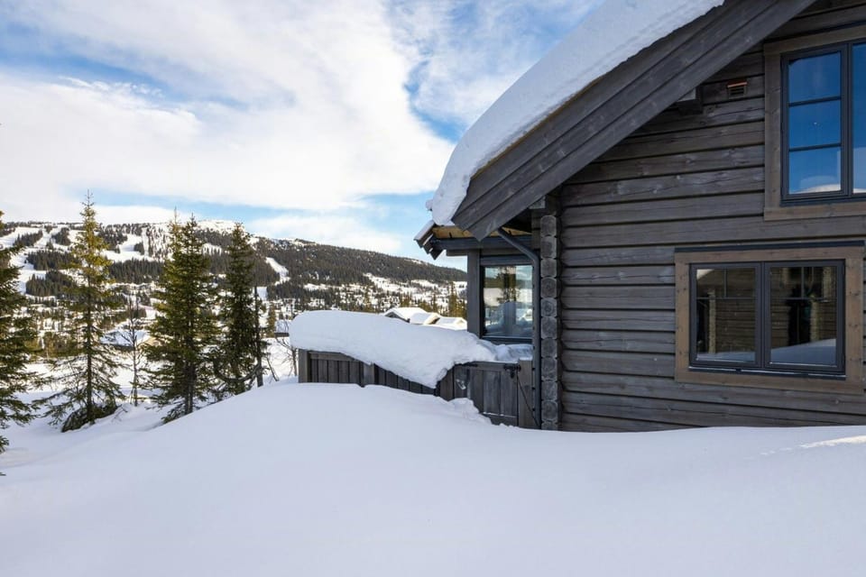 Timber cabin with ski slope and sauna Cabin in Innlandet