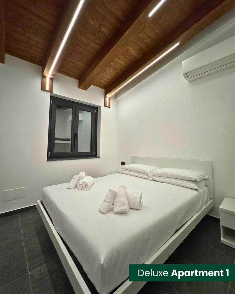 Bed, Photo of the whole room, Bedroom, towels, air conditioner