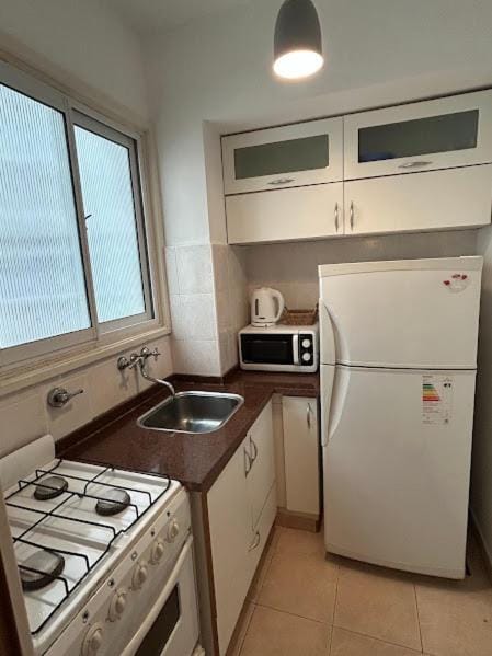 Kitchen or kitchenette, oven, toaster