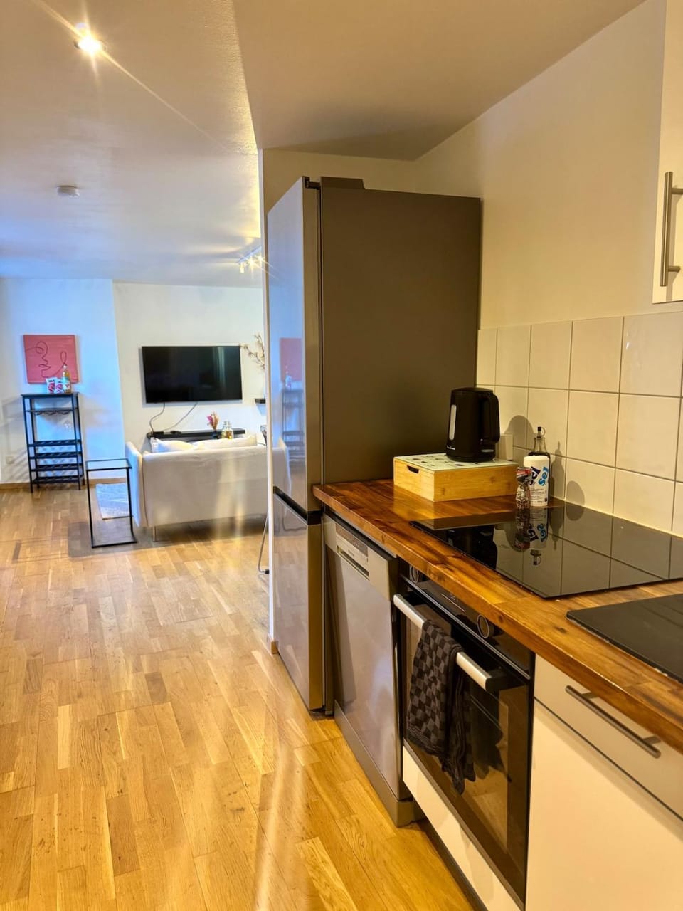 Kitchen or kitchenette, dishwasher, oven, stove