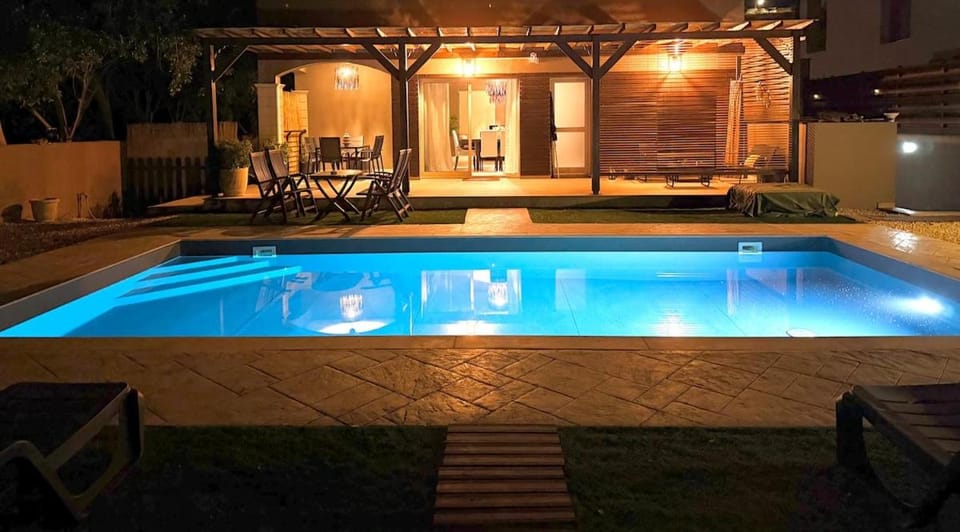 Patio, Night, Pool view, Swimming pool, sunbed