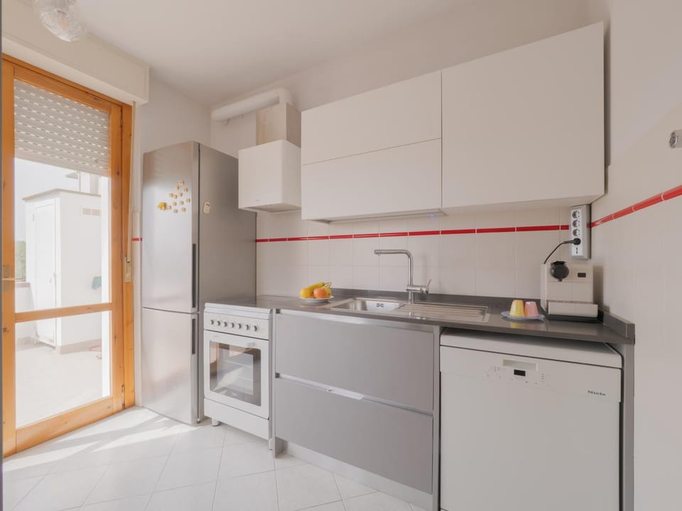 Kitchen or kitchenette, dishwasher, oven, stove