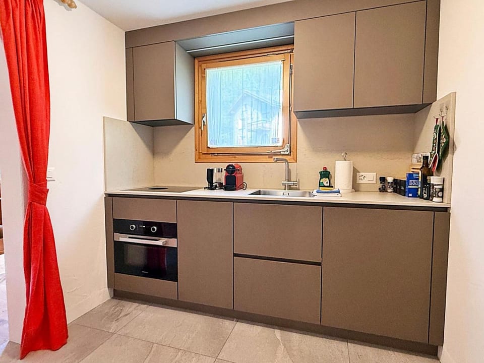Kitchen or kitchenette, dishwasher, oven, stove