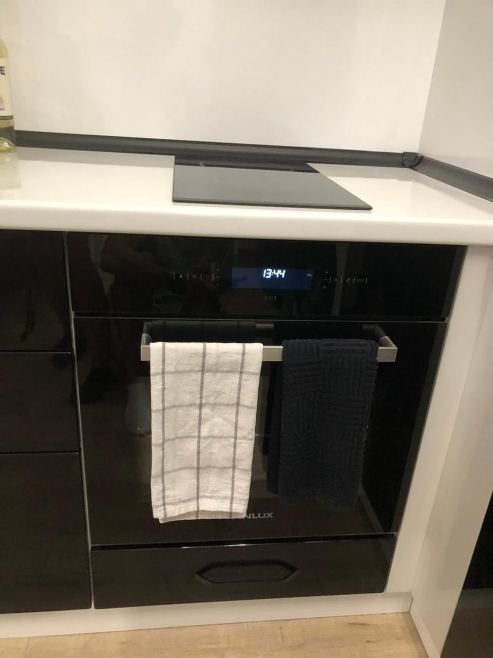 Kitchen or kitchenette, oven, stove, towels