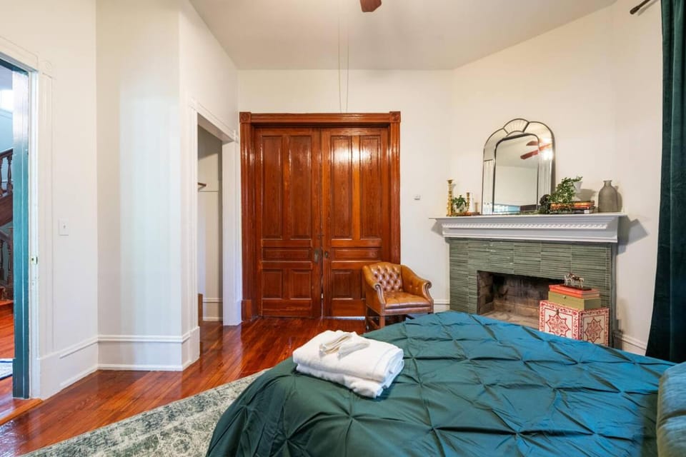 Bed, Decorative detail, Seating area, Bedroom, fireplace