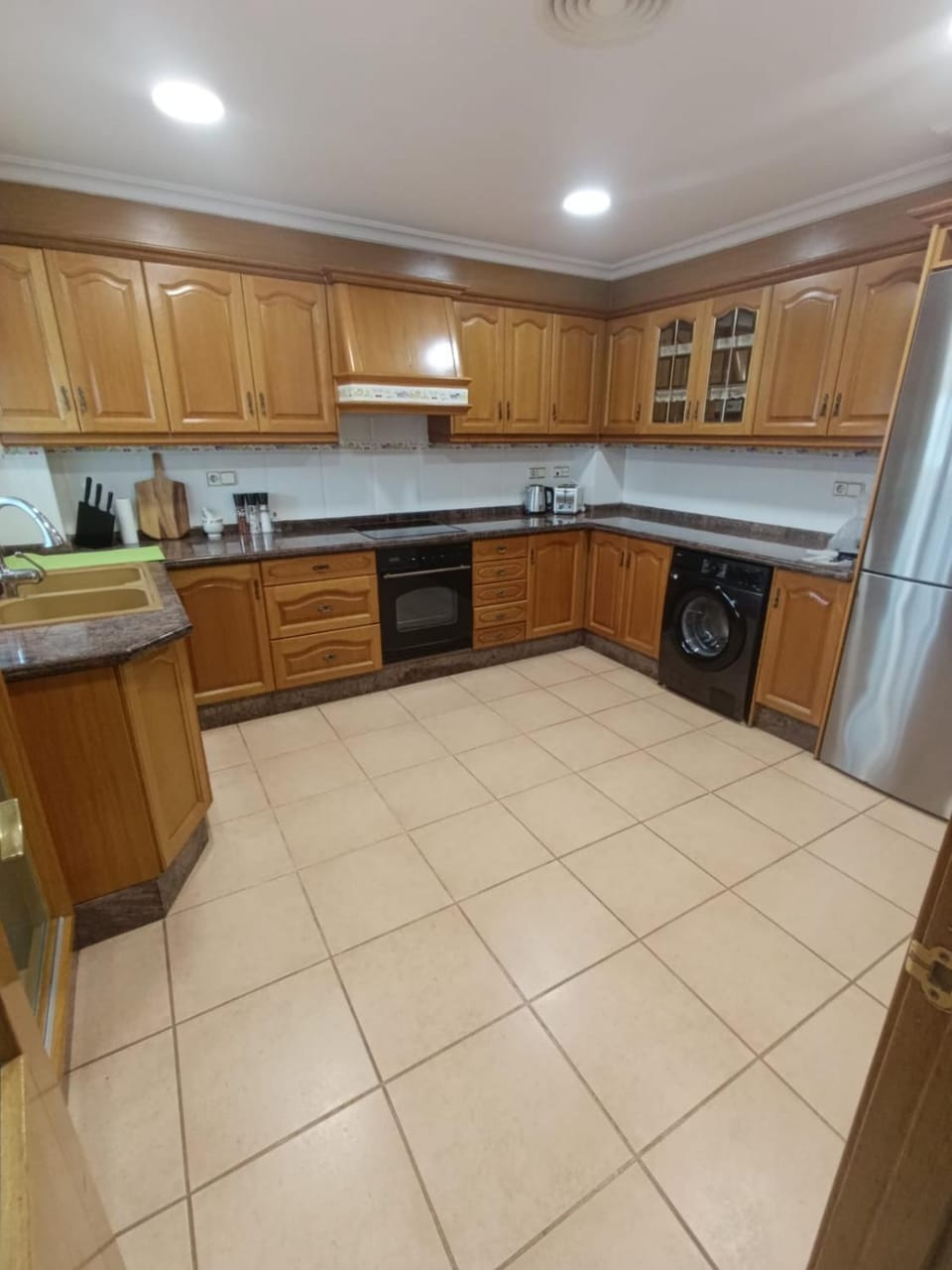 Kitchen or kitchenette, oven, stove, toaster, washing machine