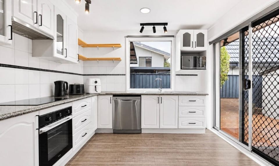 Kitchen or kitchenette, dishwasher, oven, stove, toaster