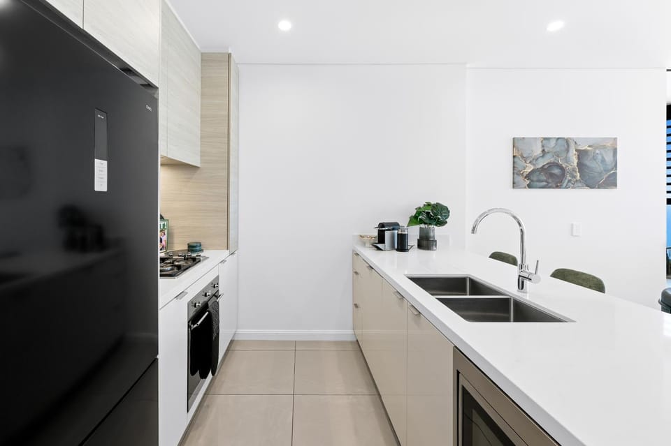 Kitchen or kitchenette, dishwasher, oven, stove