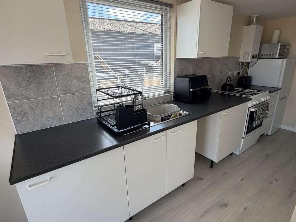 Kitchen or kitchenette, oven, stove, toaster