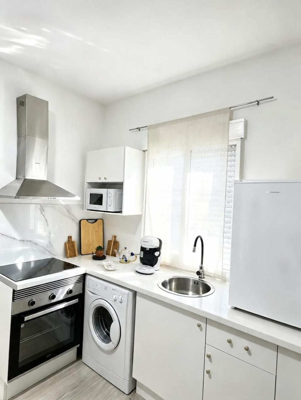 Kitchen or kitchenette, microwave, oven, stove, washing machine