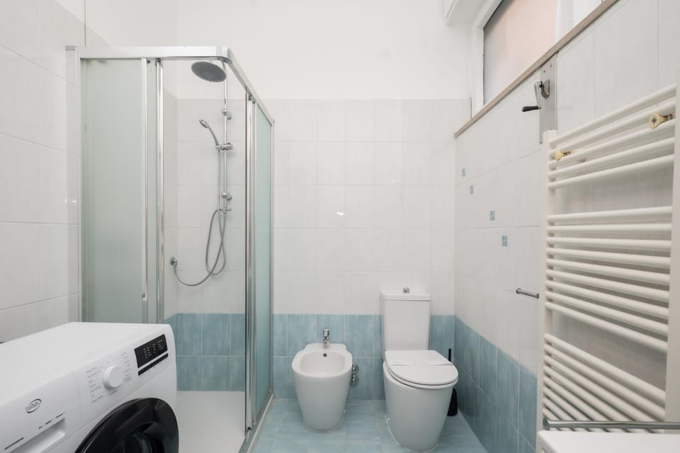 Shower, Toilet, Bathroom, bidet, towels, washing machine