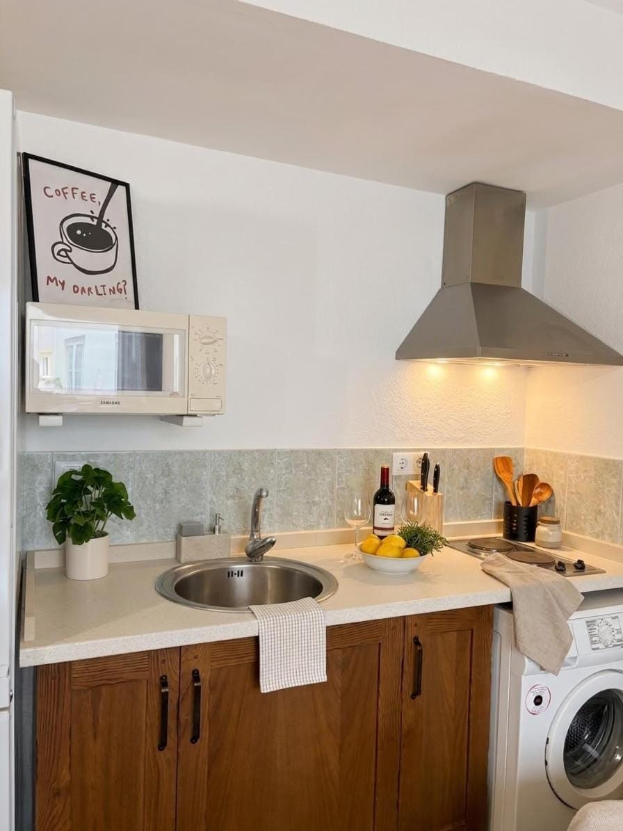 Kitchen or kitchenette, stove, washing machine, kitchen