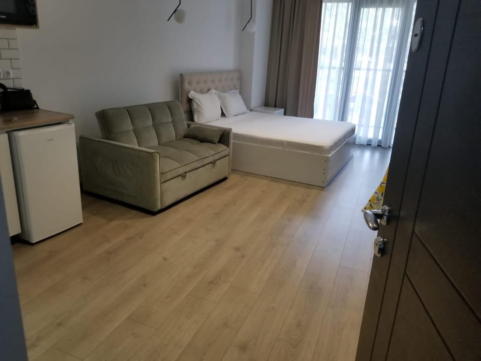 Bed, Living room, Seating area, Bedroom