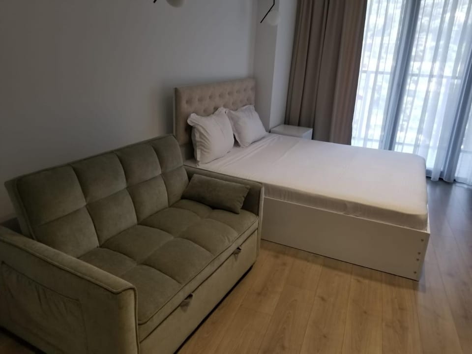 Bed, Living room, Seating area, Bedroom