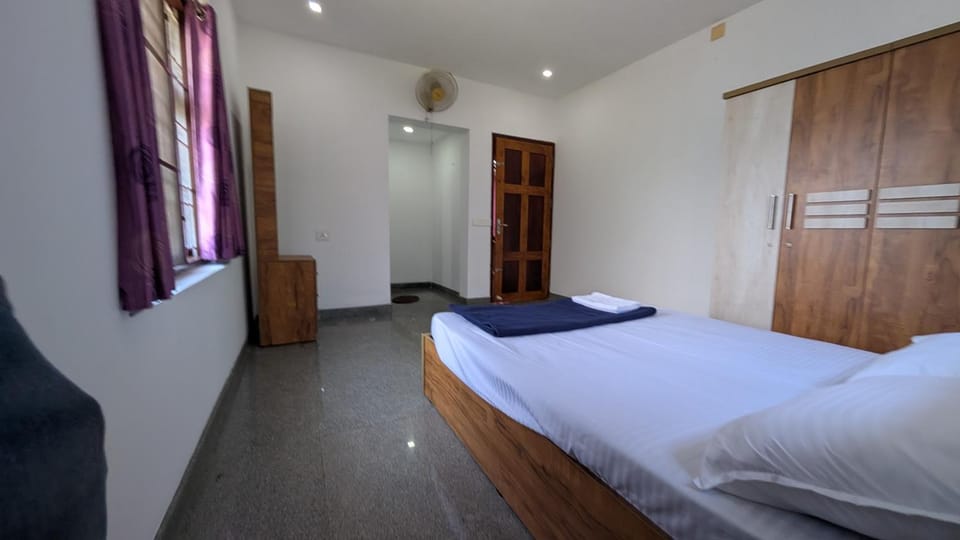 Bed, towels, wardrobe